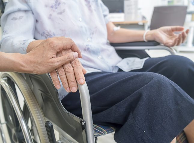 Senior woman on wheelchair in the hospital.