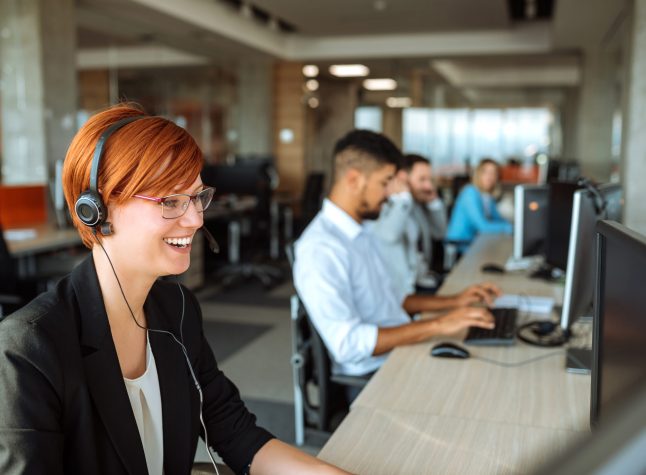 Team of business people working in a call centre on the line.