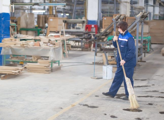 Cleaning woman at the factory